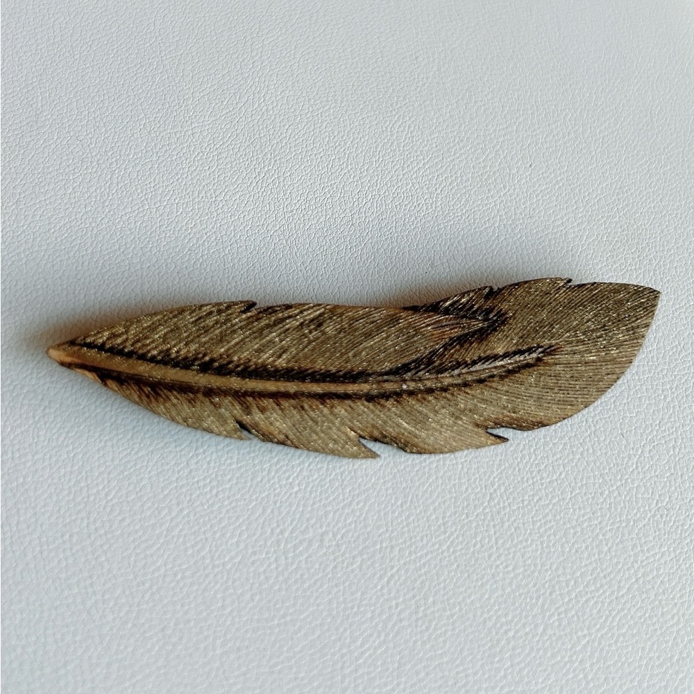 1987 handmade feather brooch